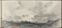 View over a plain with cottages and extensive sky