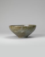 Bowl with inlaid slip decoration of bands, floral motifs, and  two fishes in the well; kiln-waster