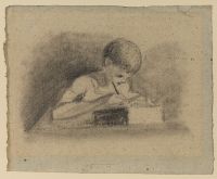 Young boy writing at a table