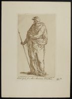 Standing male figure in a cloak holding a staff