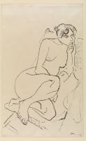 Nude woman squatting in an armchair