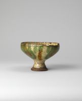 Footed bowl with incised slip decoration on exterior