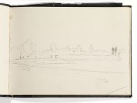 View across a river towards trees and a town