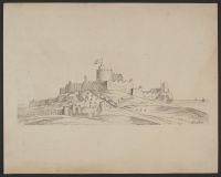 Castle on a hill with the sea in the background
