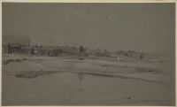 Seaside village viewed across sand flats
