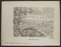 Landscape with sunlight streaming through clouds and a town on the right