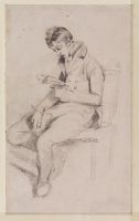 Young man seated, reading