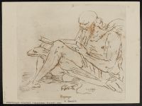 Old man seated, reading a book